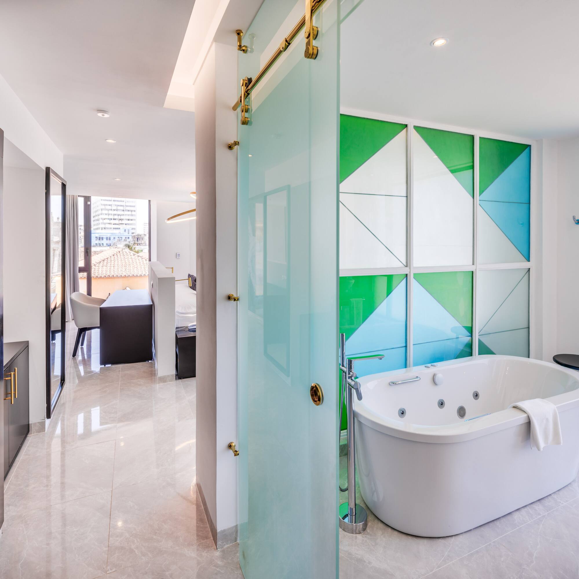 a bathroom with a tub and a shower