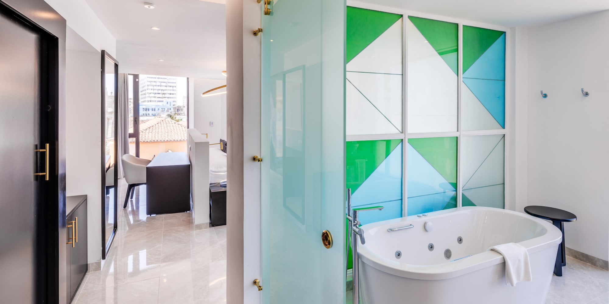 a bathroom with a tub and a shower