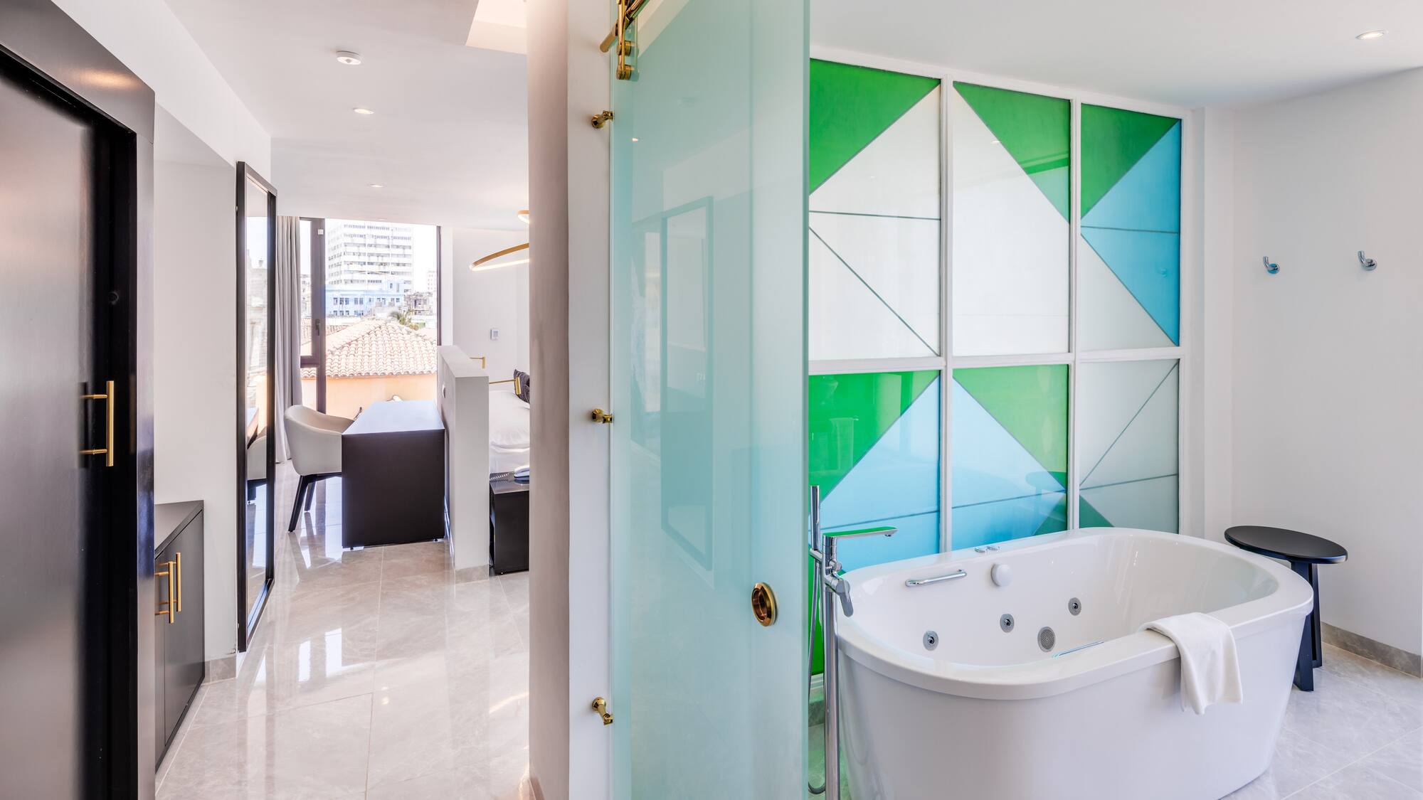 a bathroom with a tub and a shower