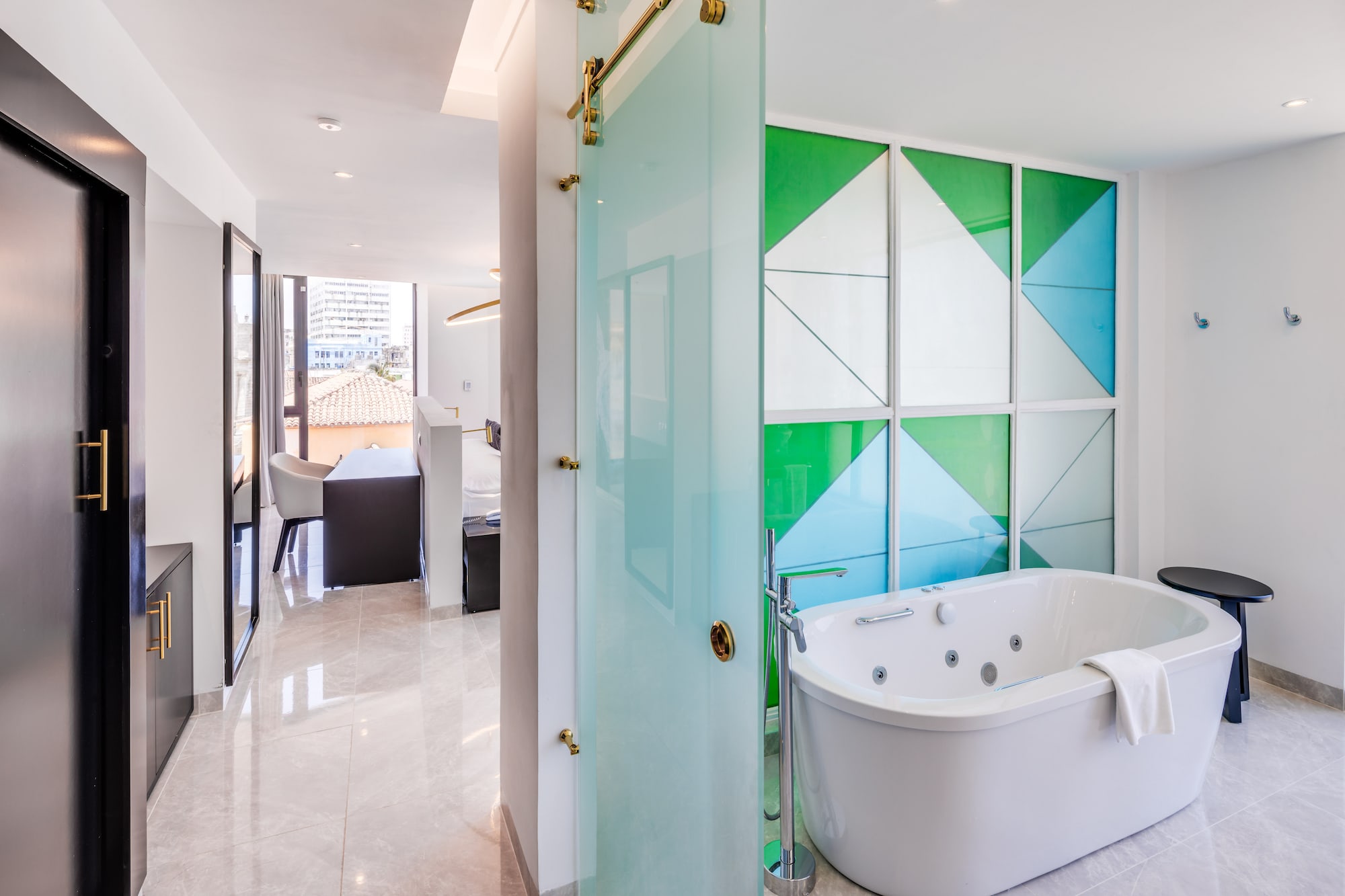 a bathroom with a tub and a shower