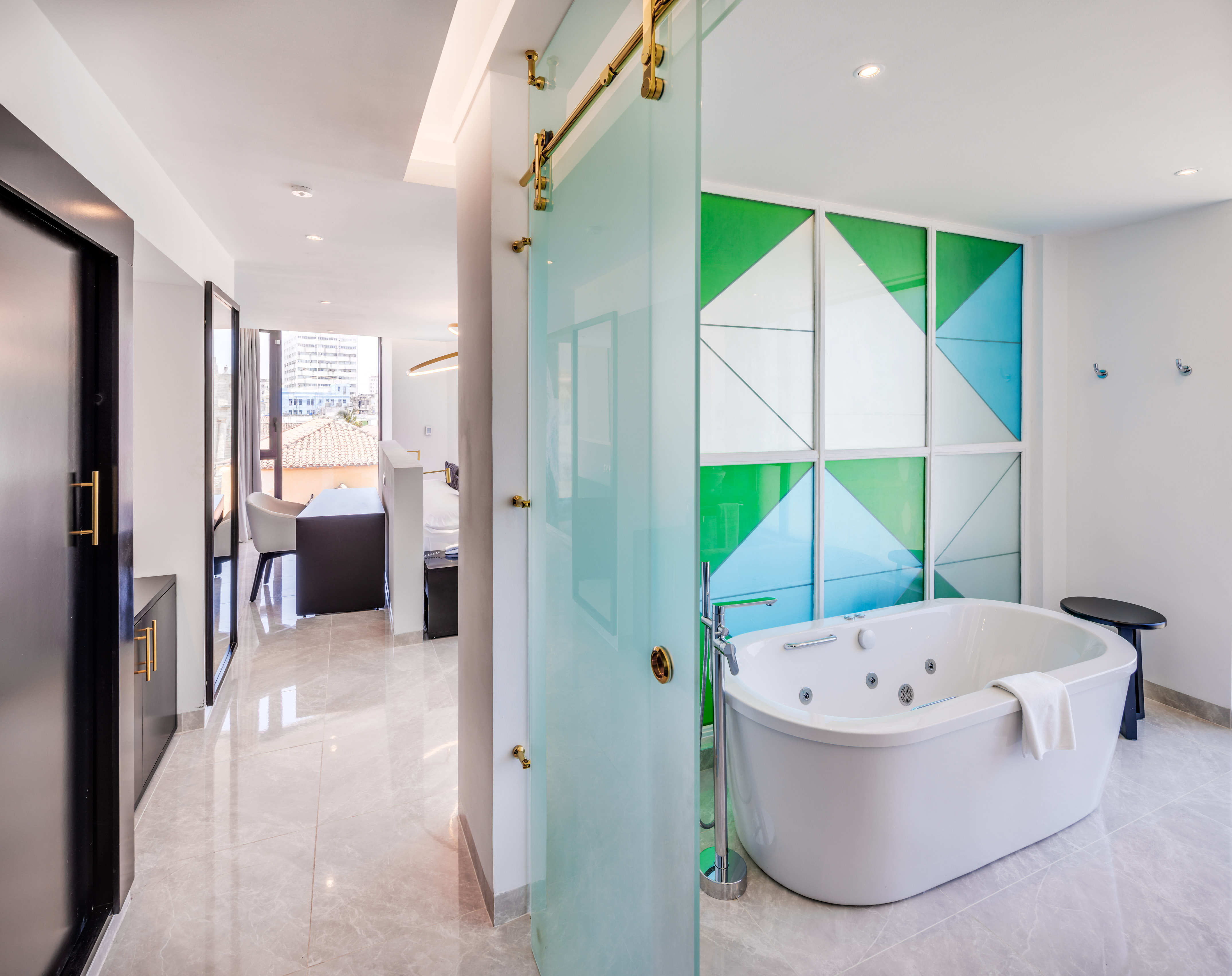 a bathroom with a tub and a shower