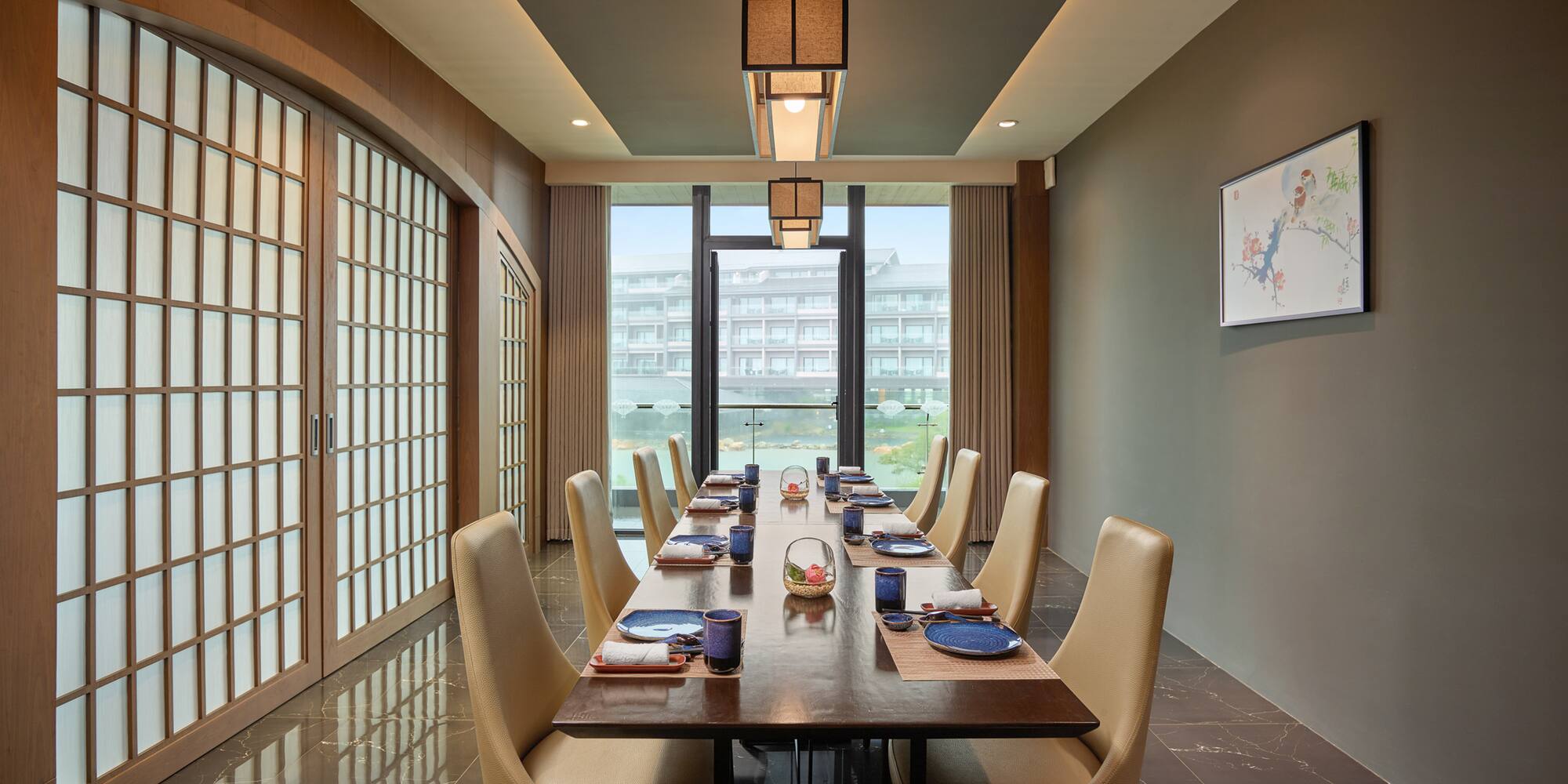 a dining room with a table and chairs