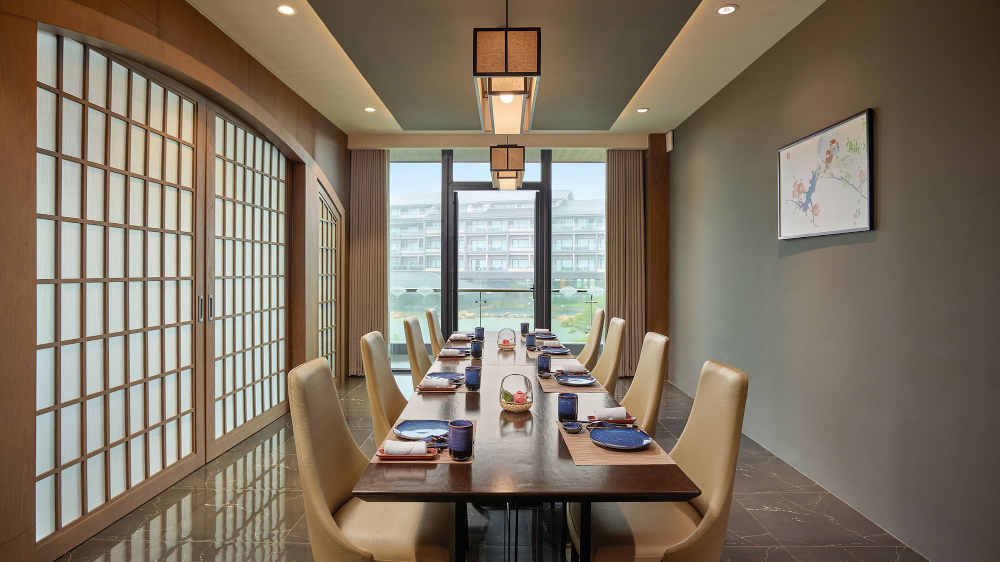 a dining room with a table and chairs