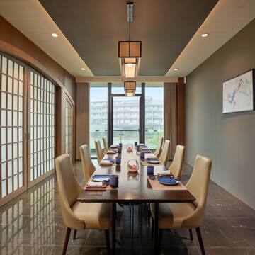 a dining room with a table and chairs
