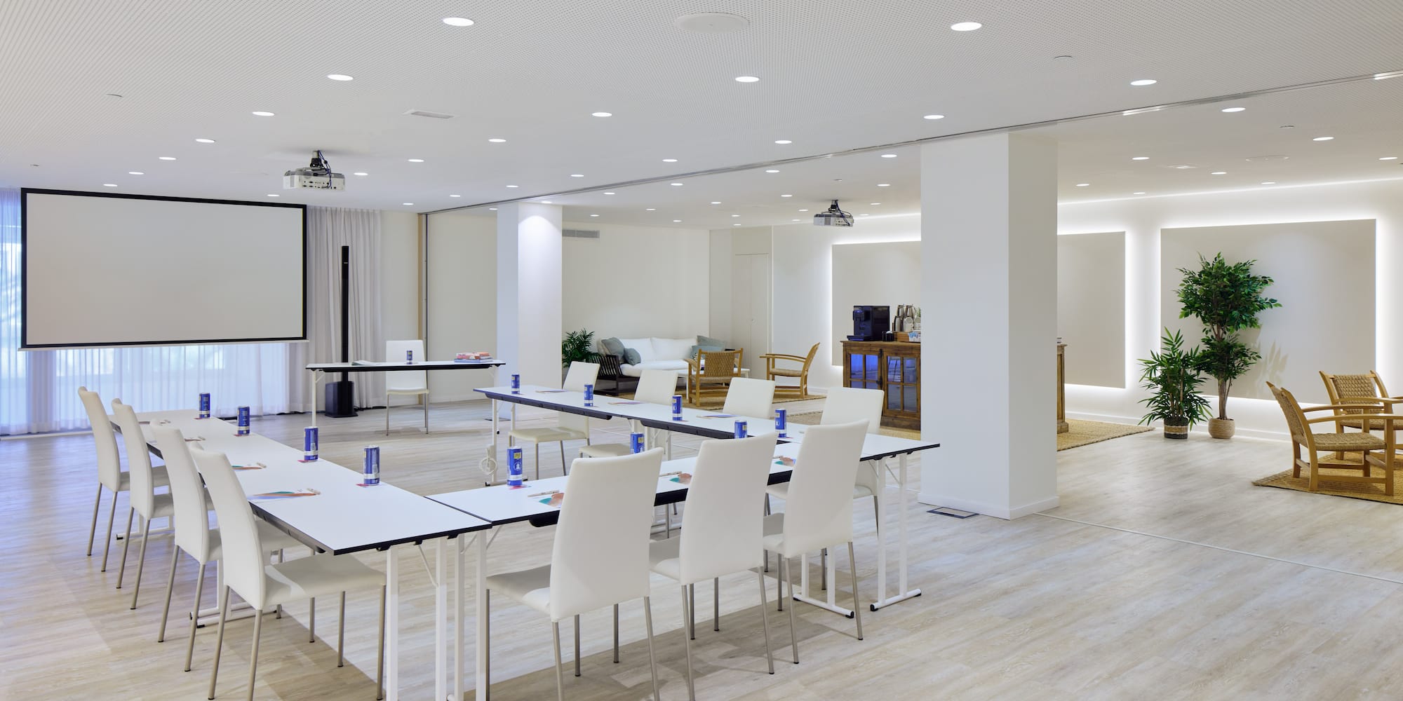a room with white tables and chairs