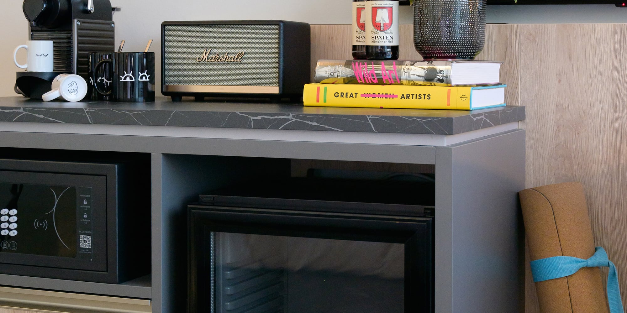 a small refrigerator with drinks on it