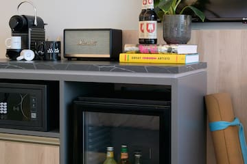 a small refrigerator with drinks on it