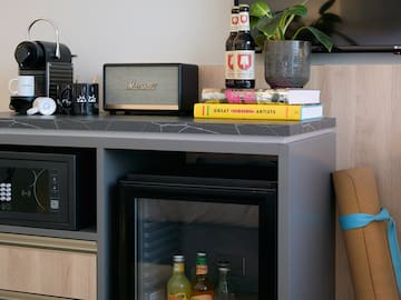 a small refrigerator with drinks on it