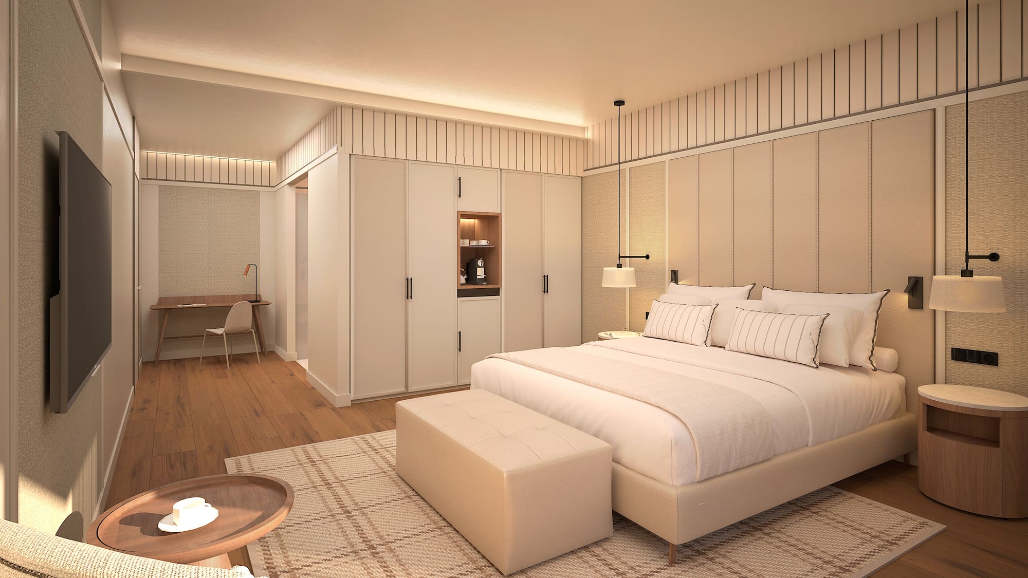 Modernes Hotelzimmer mit großem Doppelbett, Sitzecke und hellem Holzboden. - Deluxe Room mit Solarium - Hotel Golf Santa Ponsa Meliá Collection, Mallorca