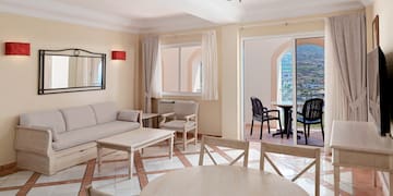 a living room with a table and chairs