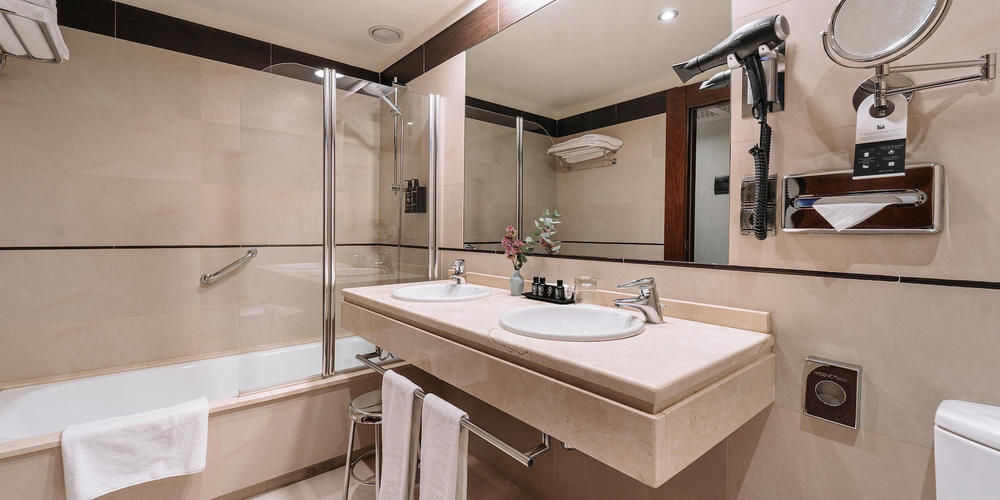 a bathroom with a shower and sink