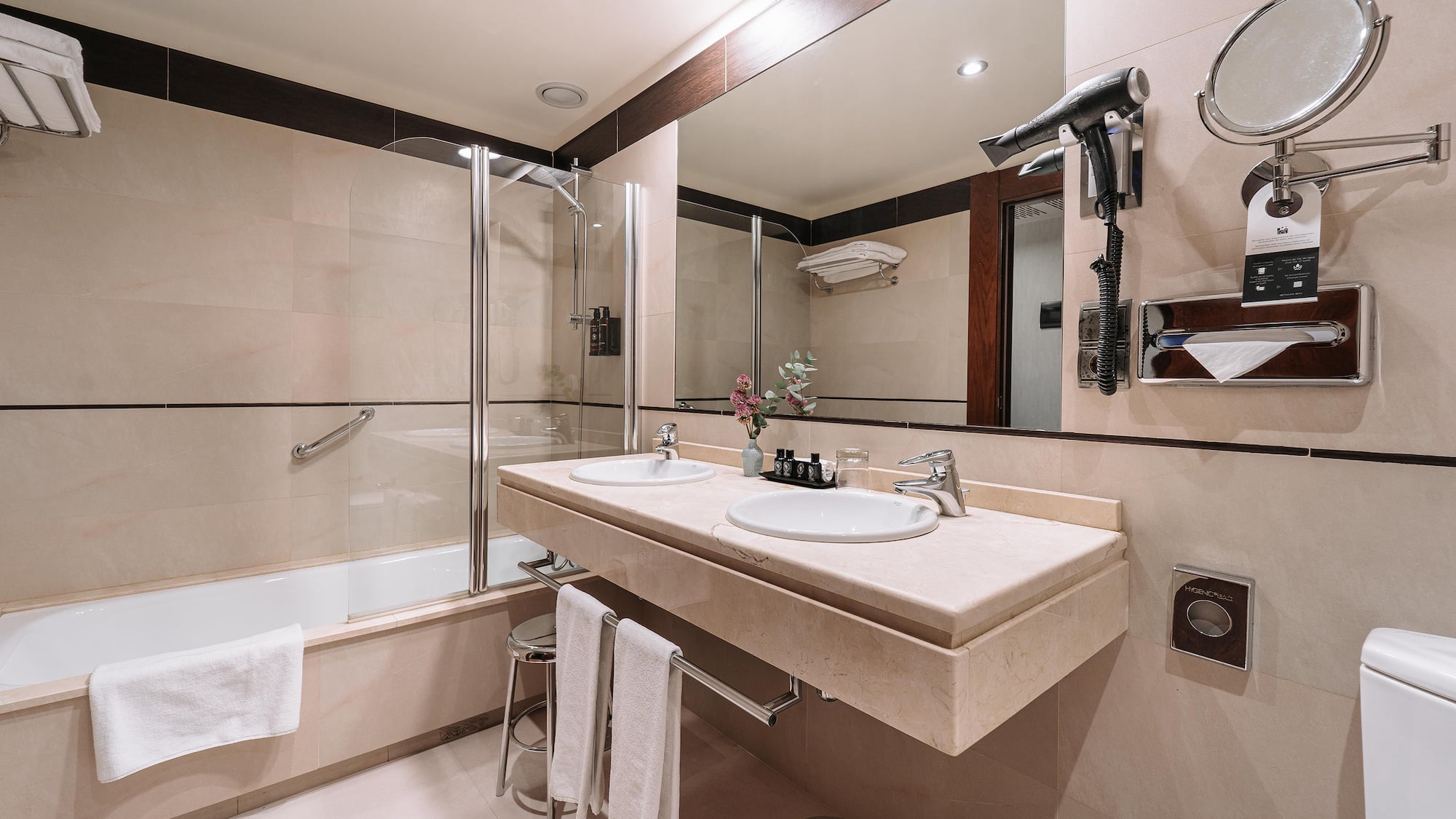 a bathroom with a shower and sink