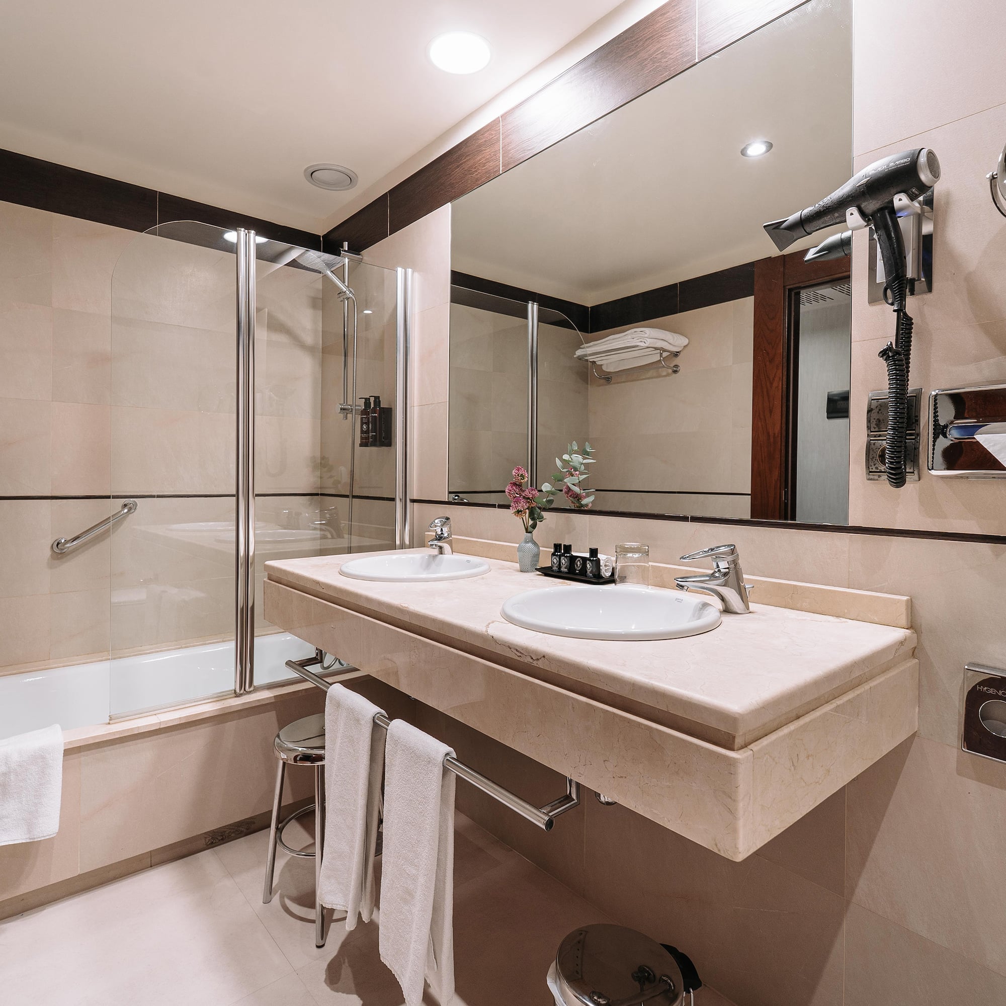 a bathroom with a shower and sink