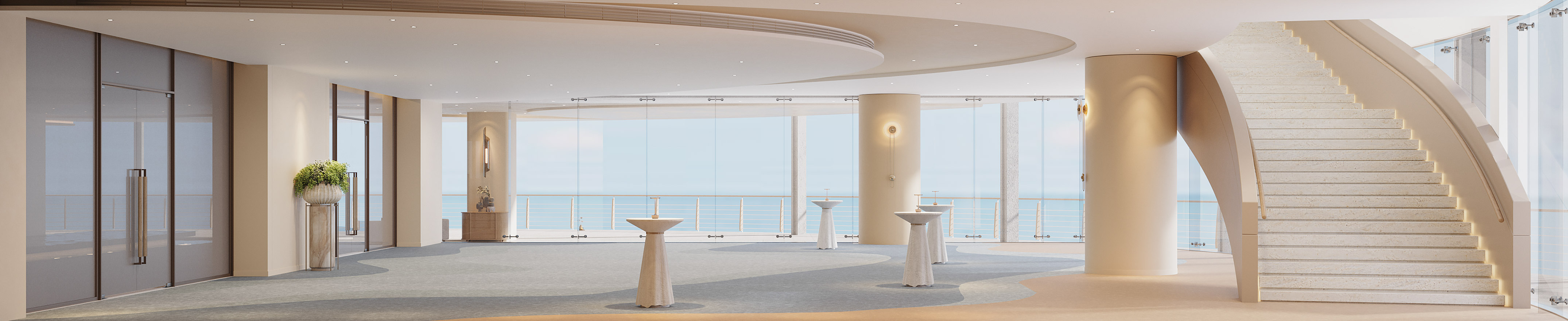 Luxury event space with ocean view, grand staircase, and modern design.