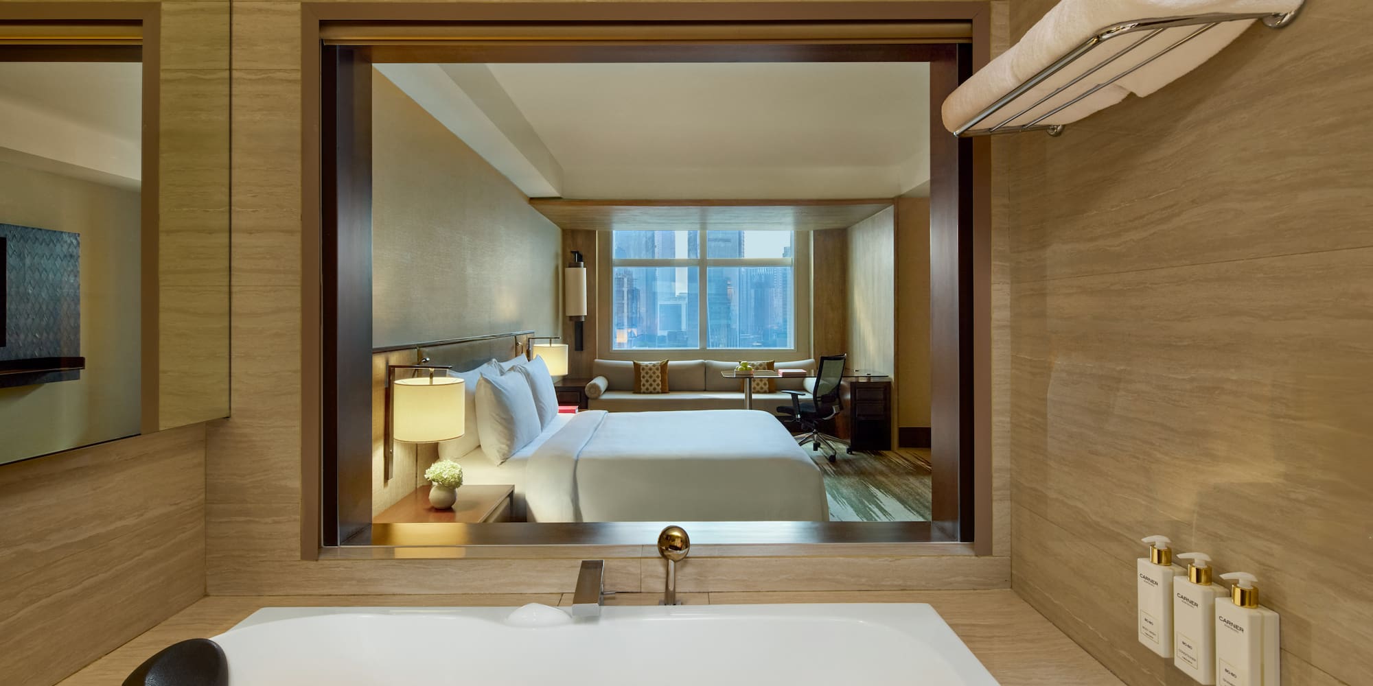 a bathroom with a window and a bed