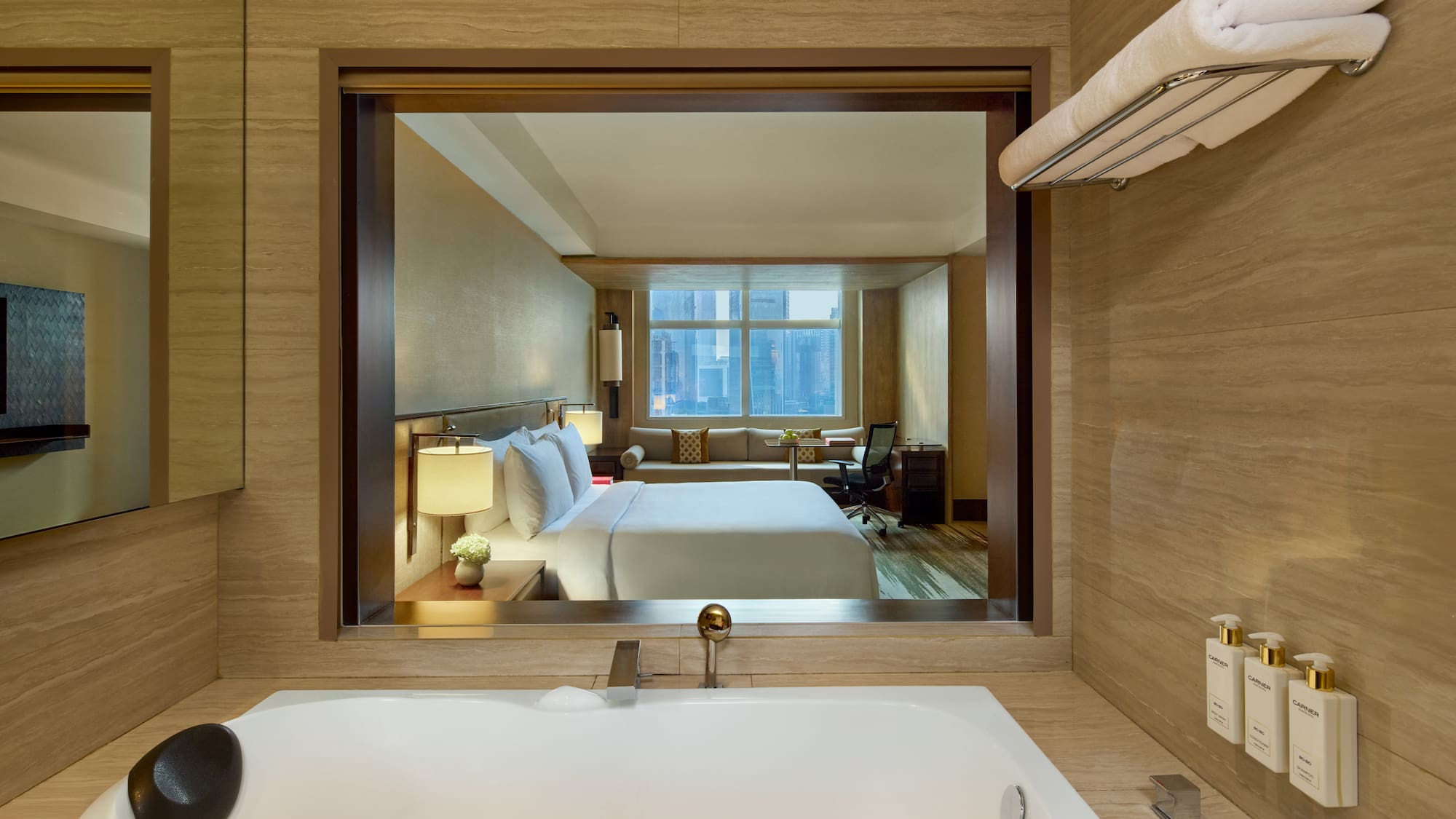 a bathroom with a window and a bed