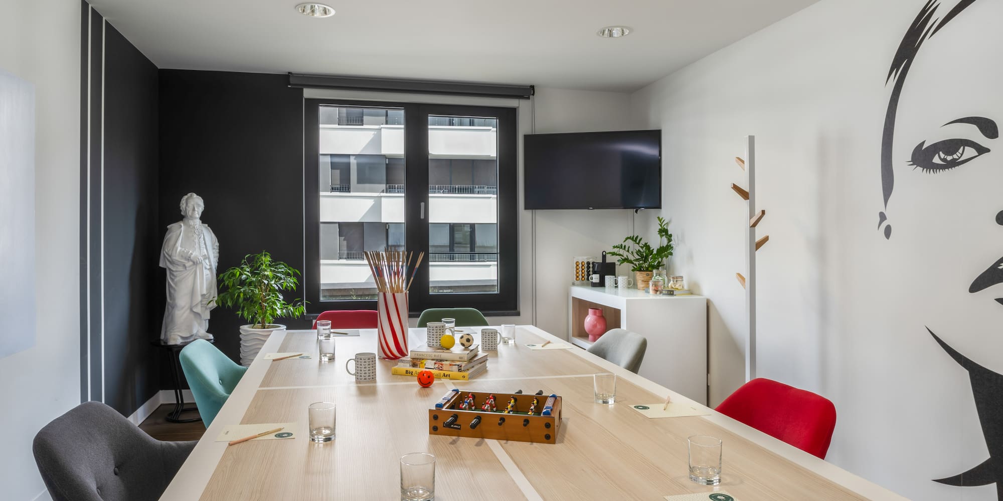 a room with a table and chairs