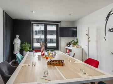 a room with a table and chairs