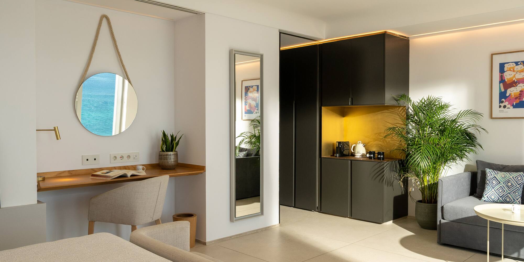 a room with a mirror and a table and plants