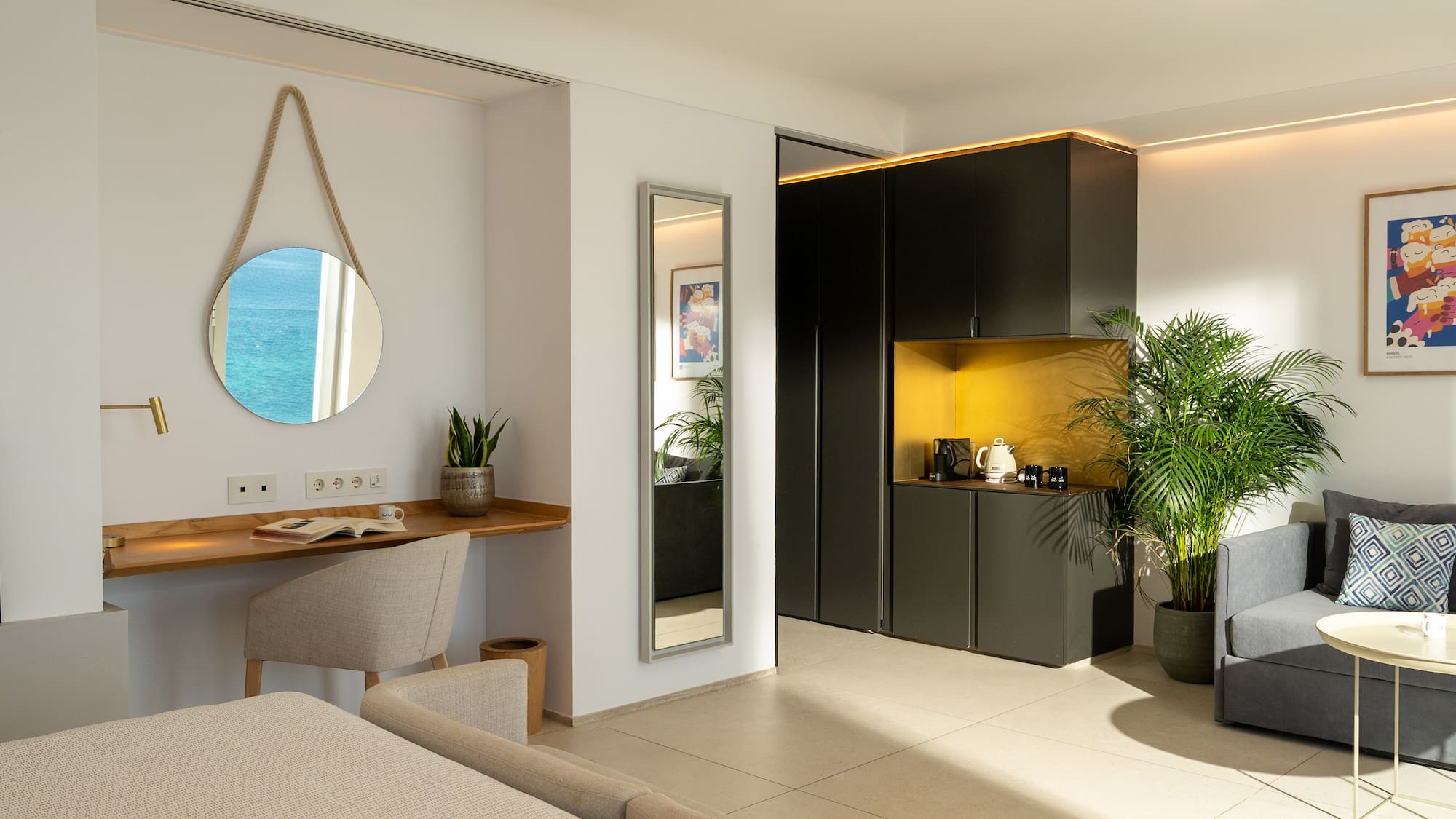 a room with a mirror and a table and plants