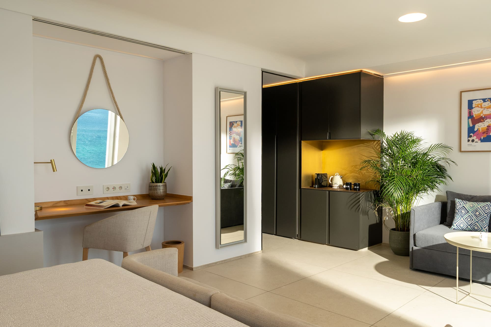 a room with a mirror and a table and plants