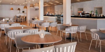 a restaurant with tables and chairs