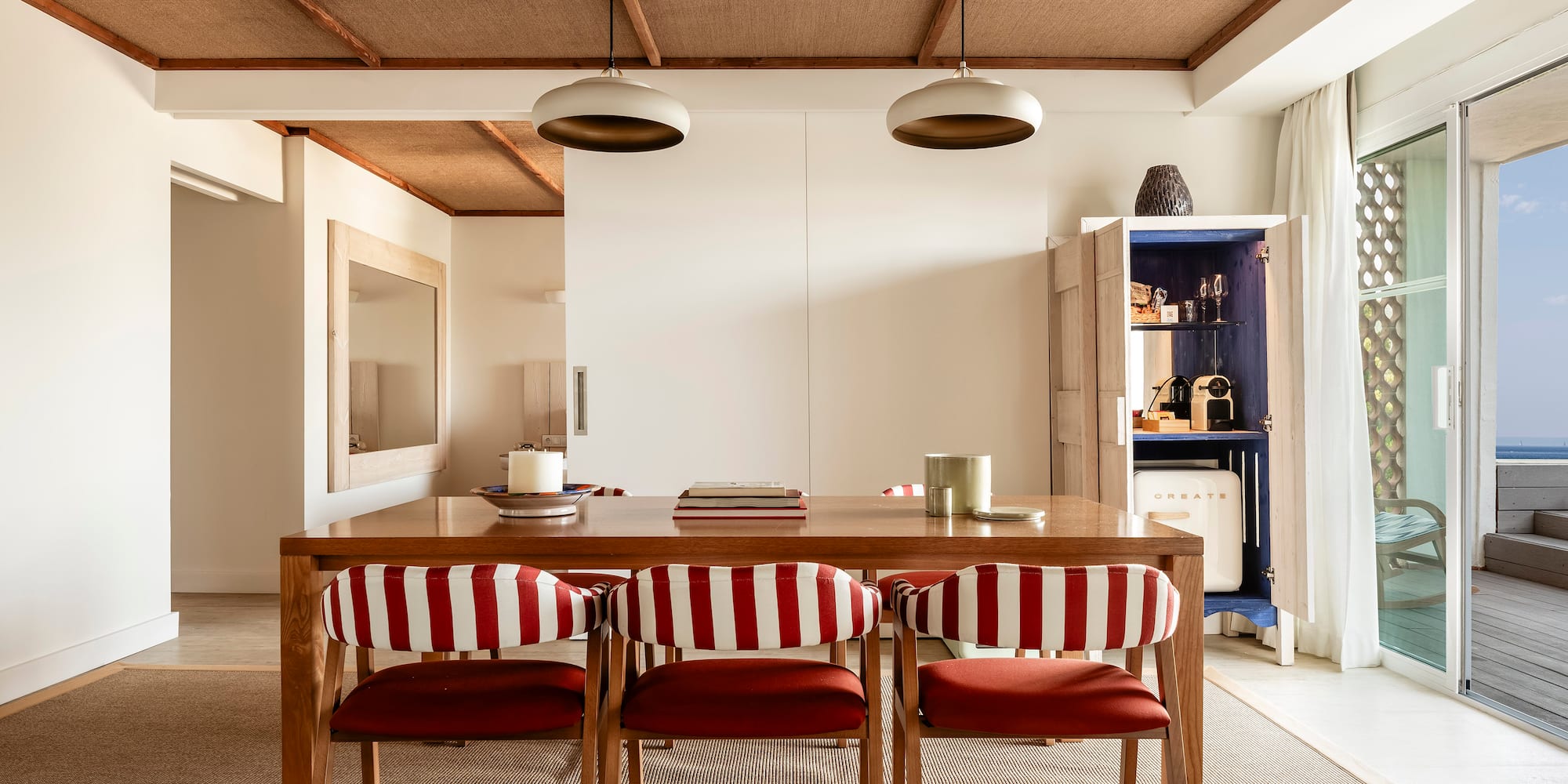 a dining table with chairs in a room