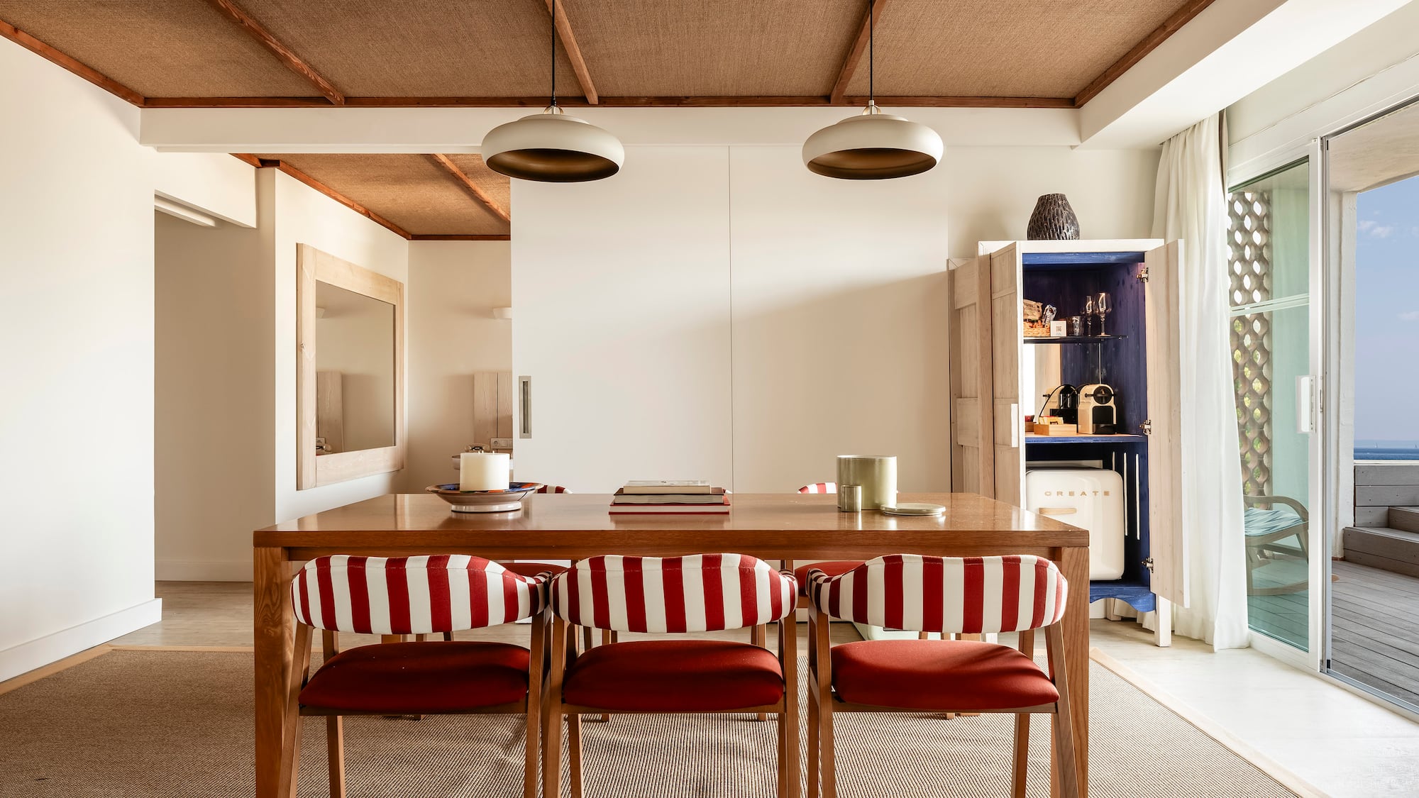 a dining table with chairs in a room