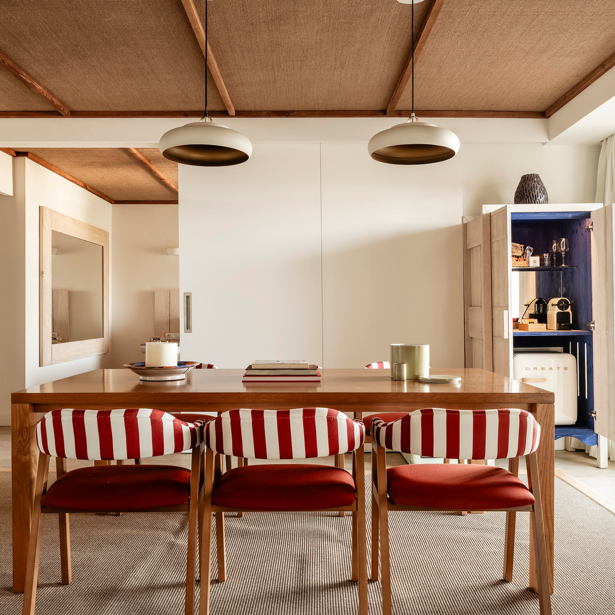 a dining table with chairs in a room