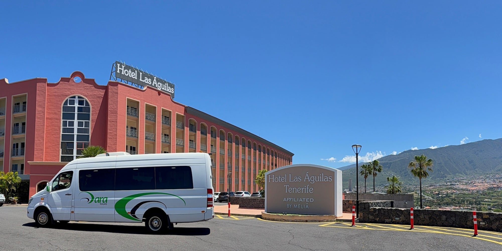 Hotel Las Águilas Tenerife, shuttle van, welcome sign, mountain view.