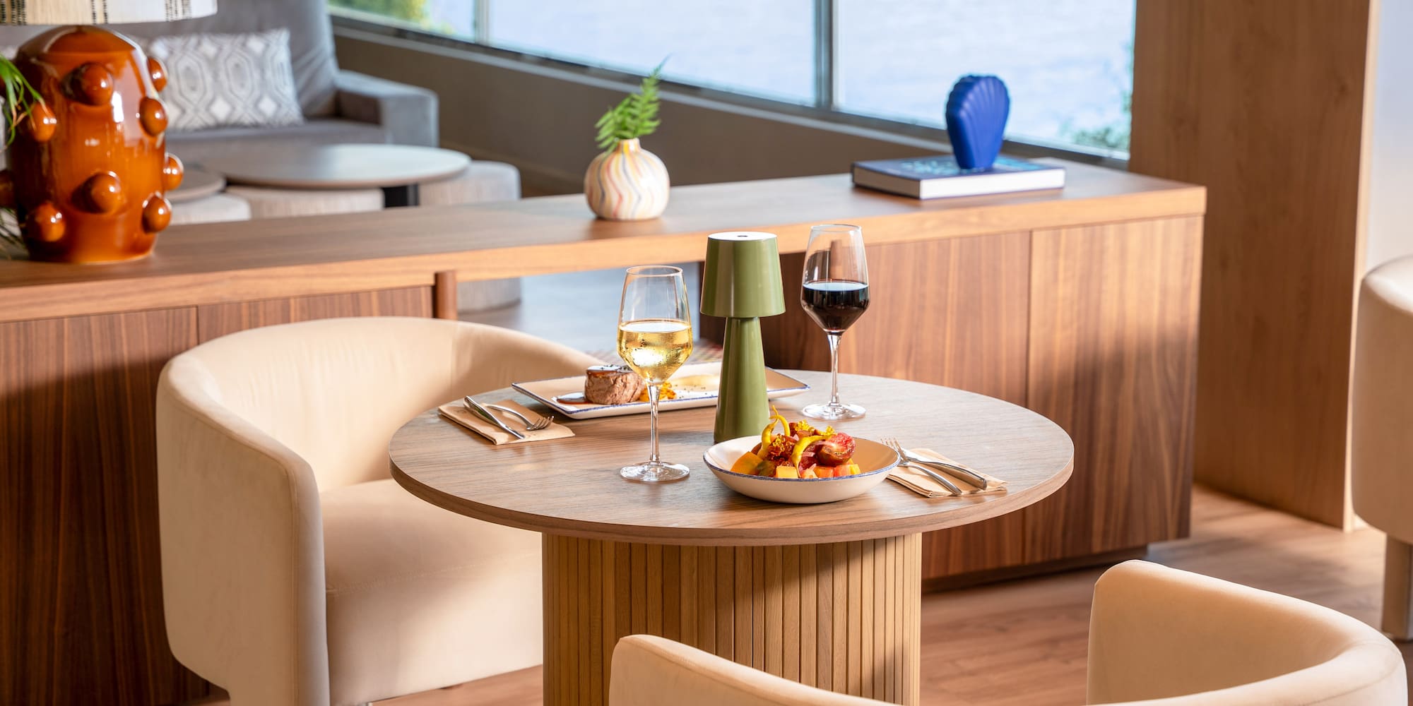 a table with food and wine glasses on it