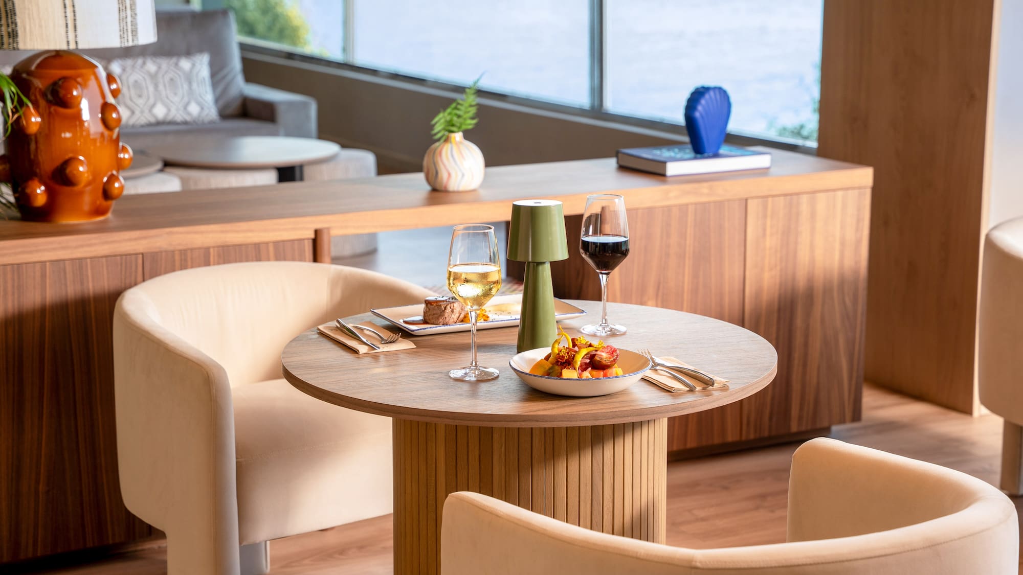 a table with food and wine glasses on it