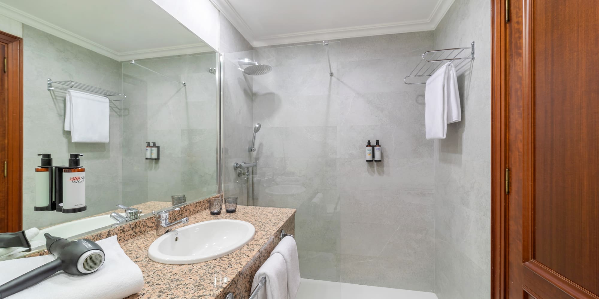 a bathroom with a shower and sink