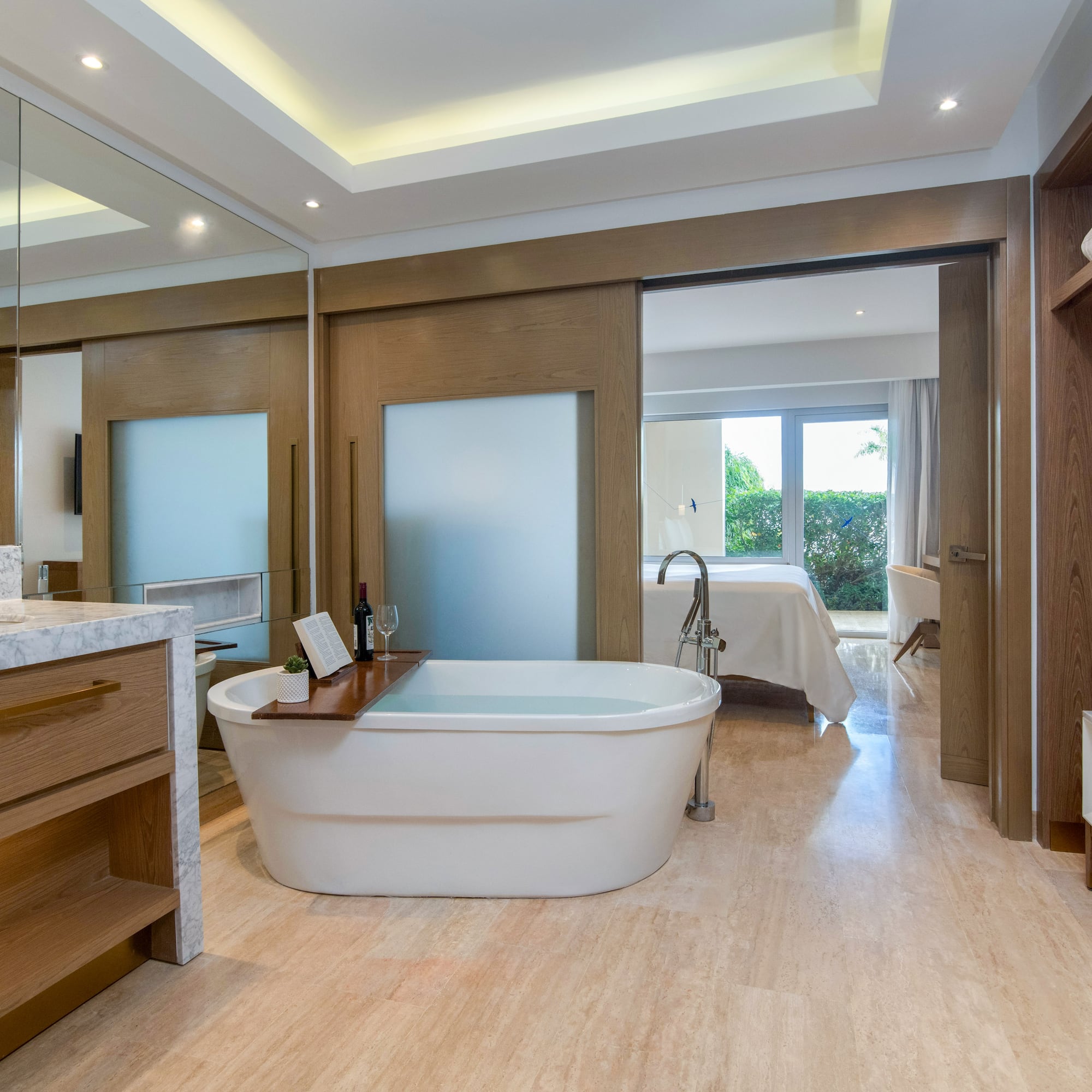 a bathroom with a tub and a mirror