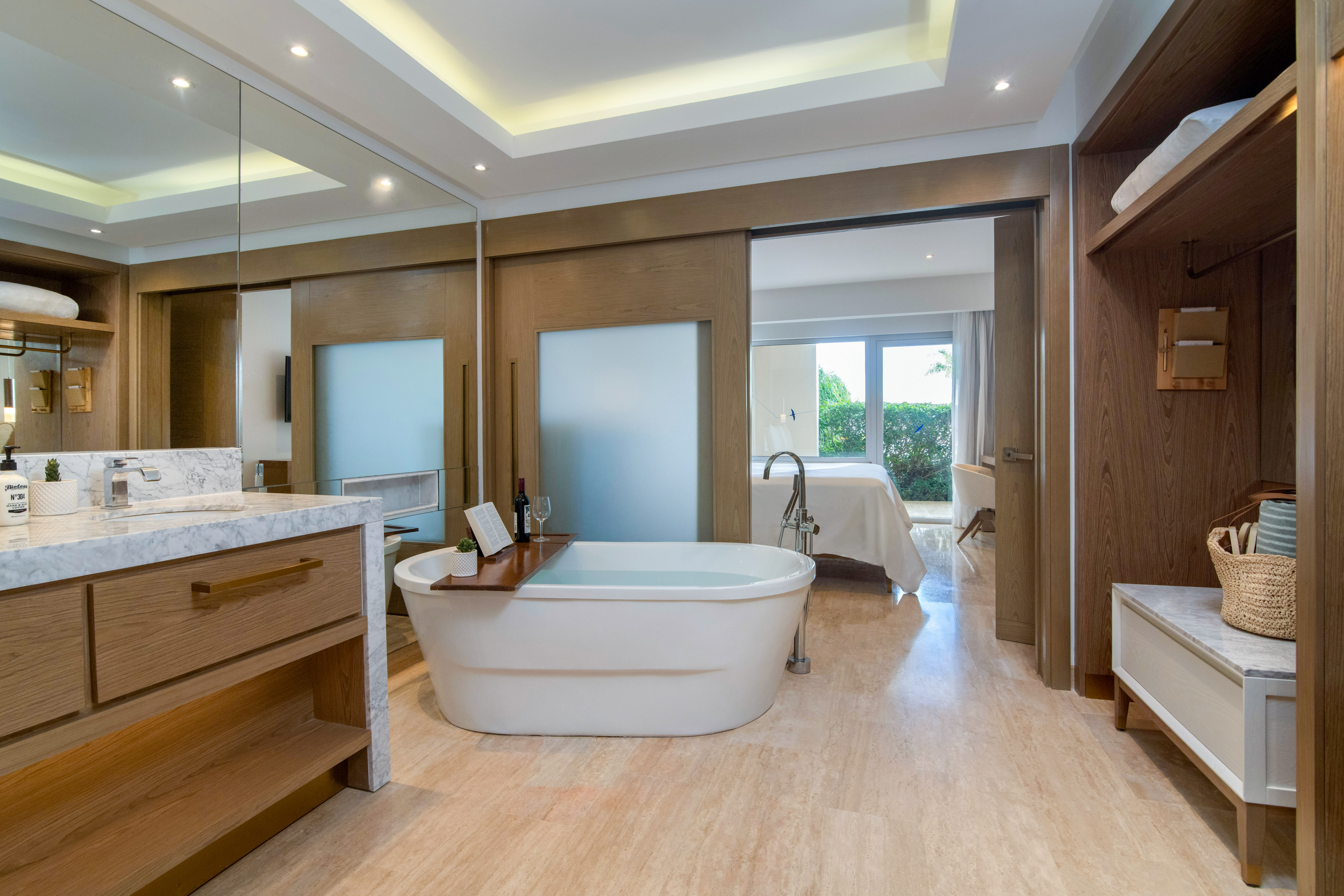 a bathroom with a tub and a mirror