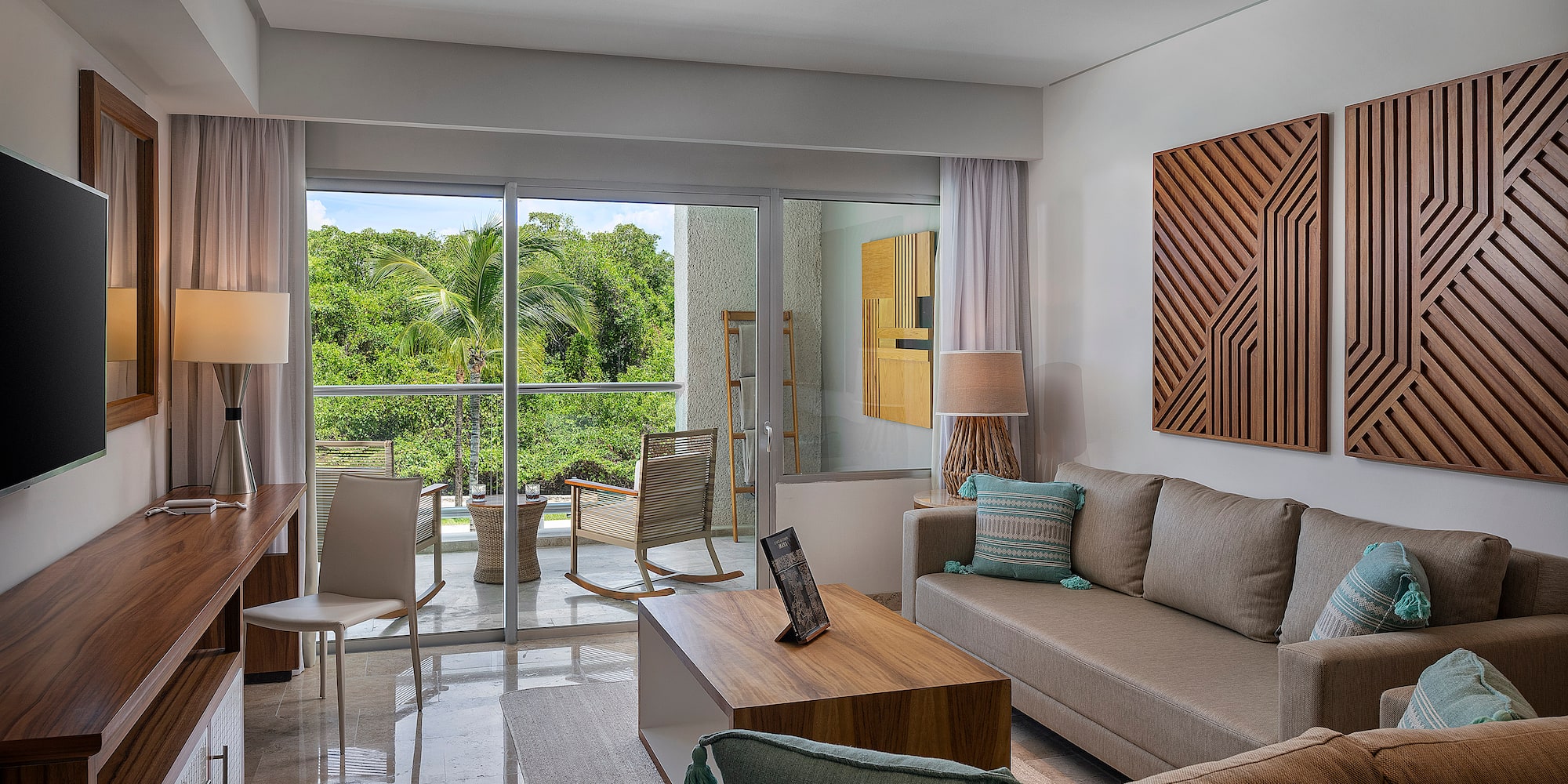 a living room with a glass door and a couch