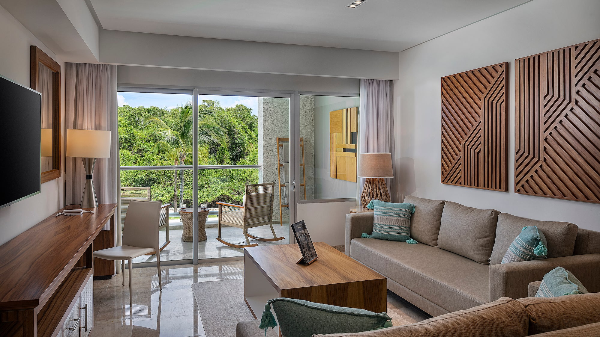 a living room with a glass door and a couch