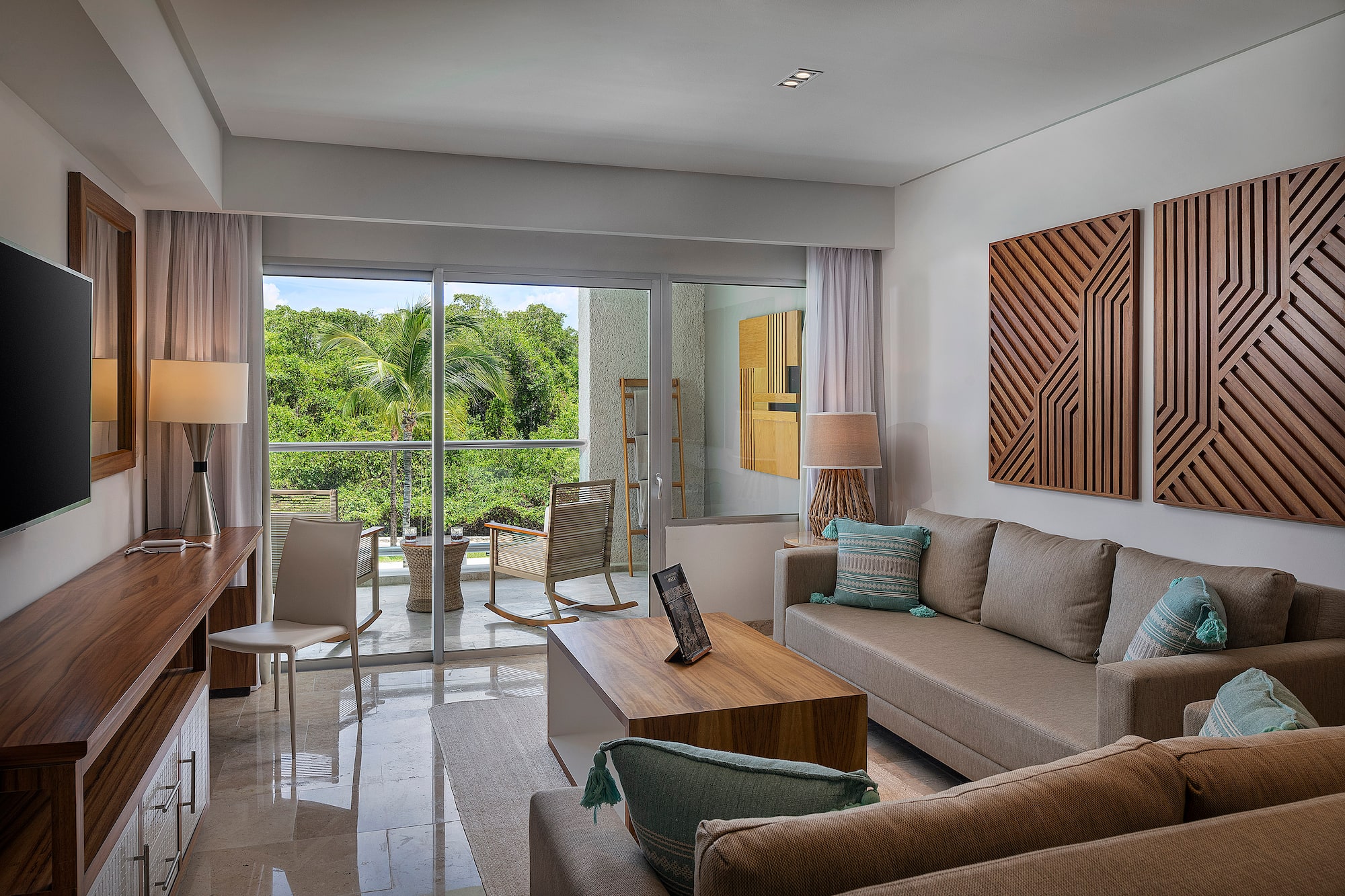 a living room with a glass door and a couch