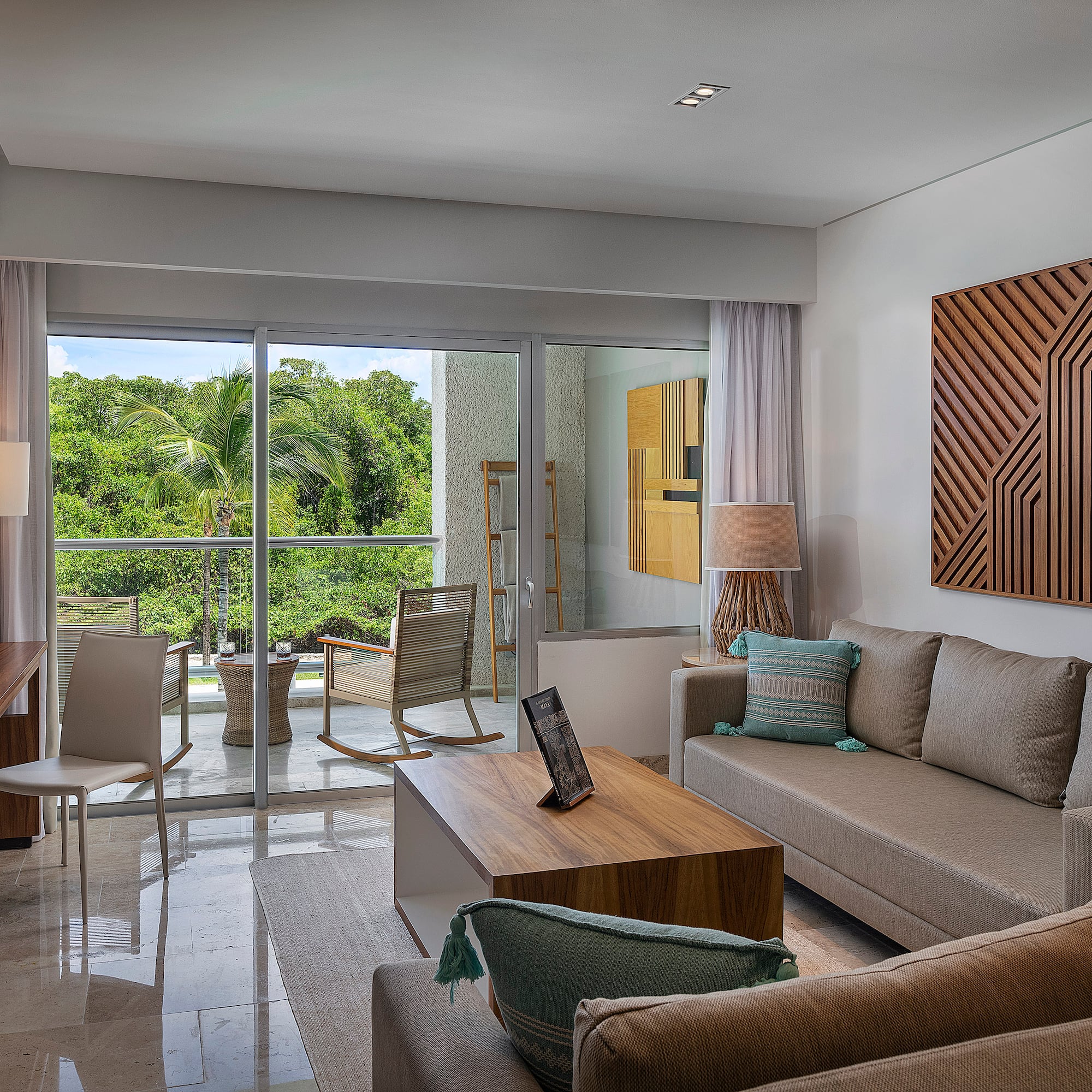 a living room with a glass door and a couch