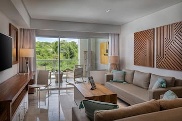 a living room with a glass door and a couch