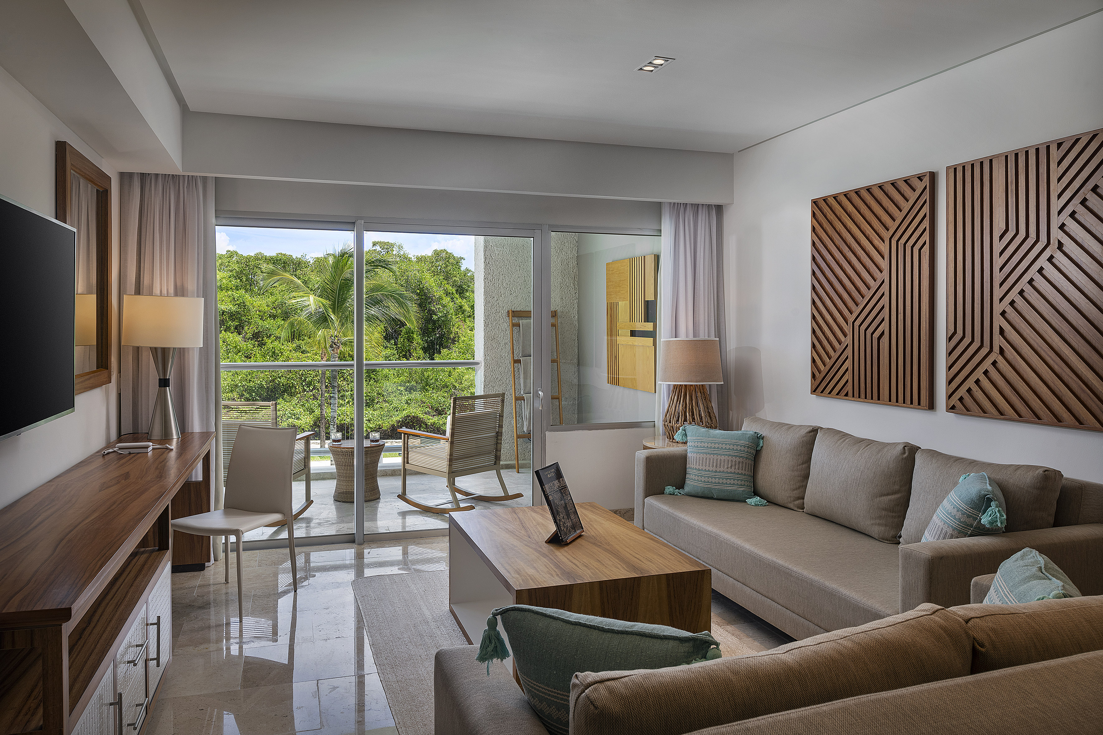a living room with a glass door and a couch