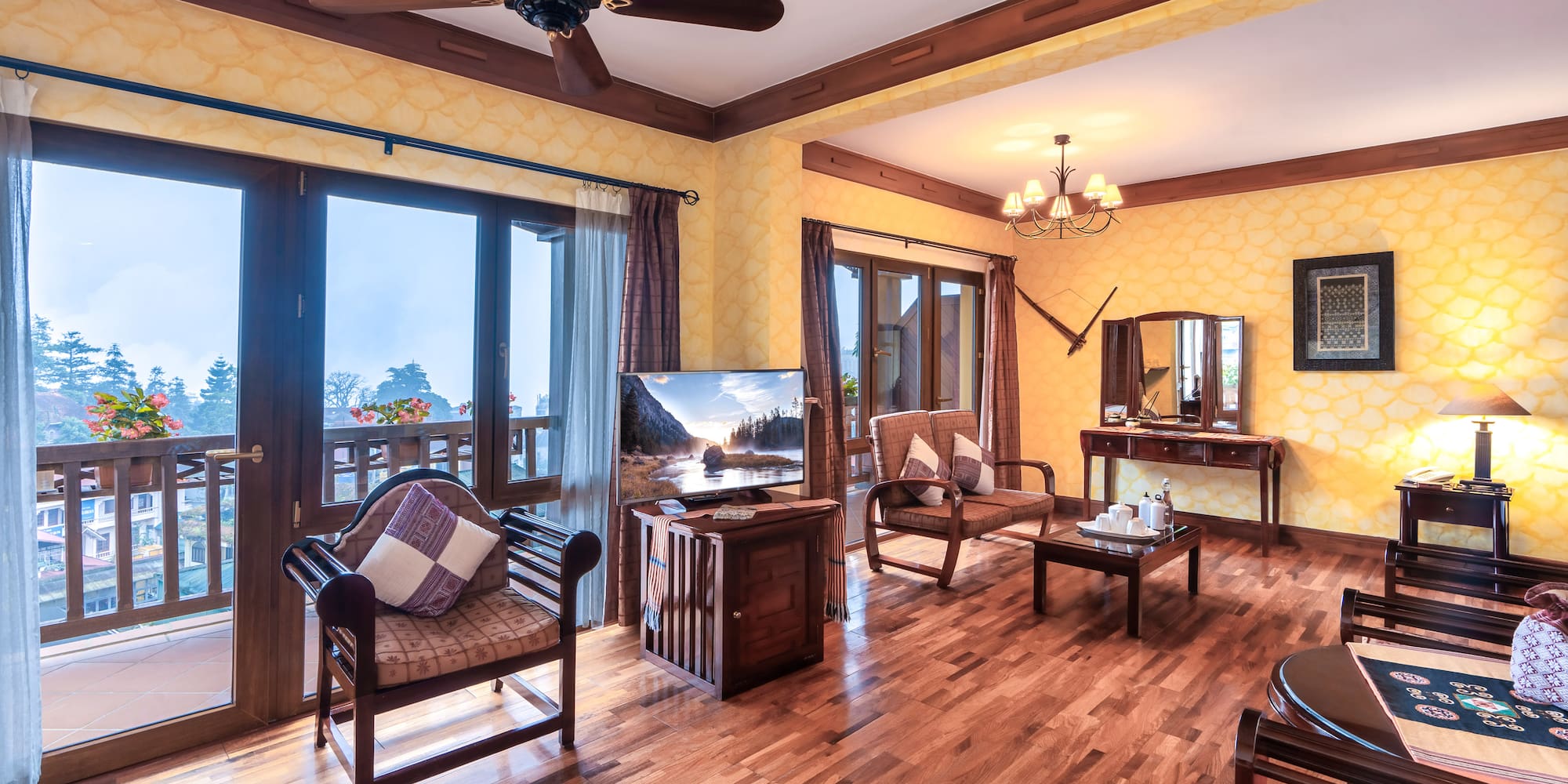 a room with a wood floor and a ceiling fan