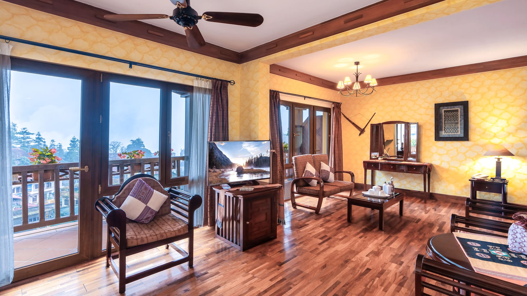 a room with a wood floor and a ceiling fan