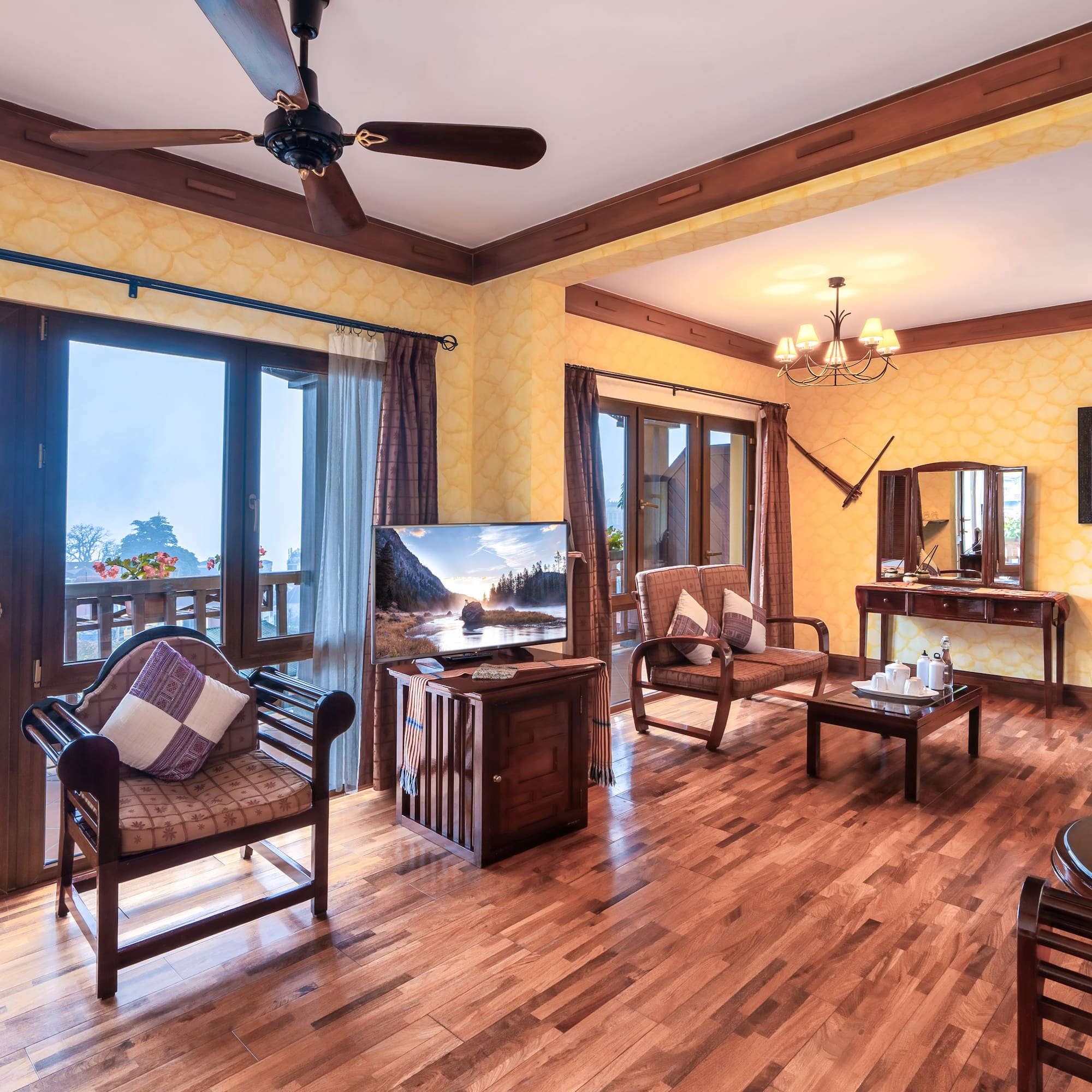 a room with a wood floor and a ceiling fan