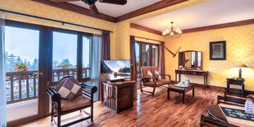 a room with a wood floor and a ceiling fan