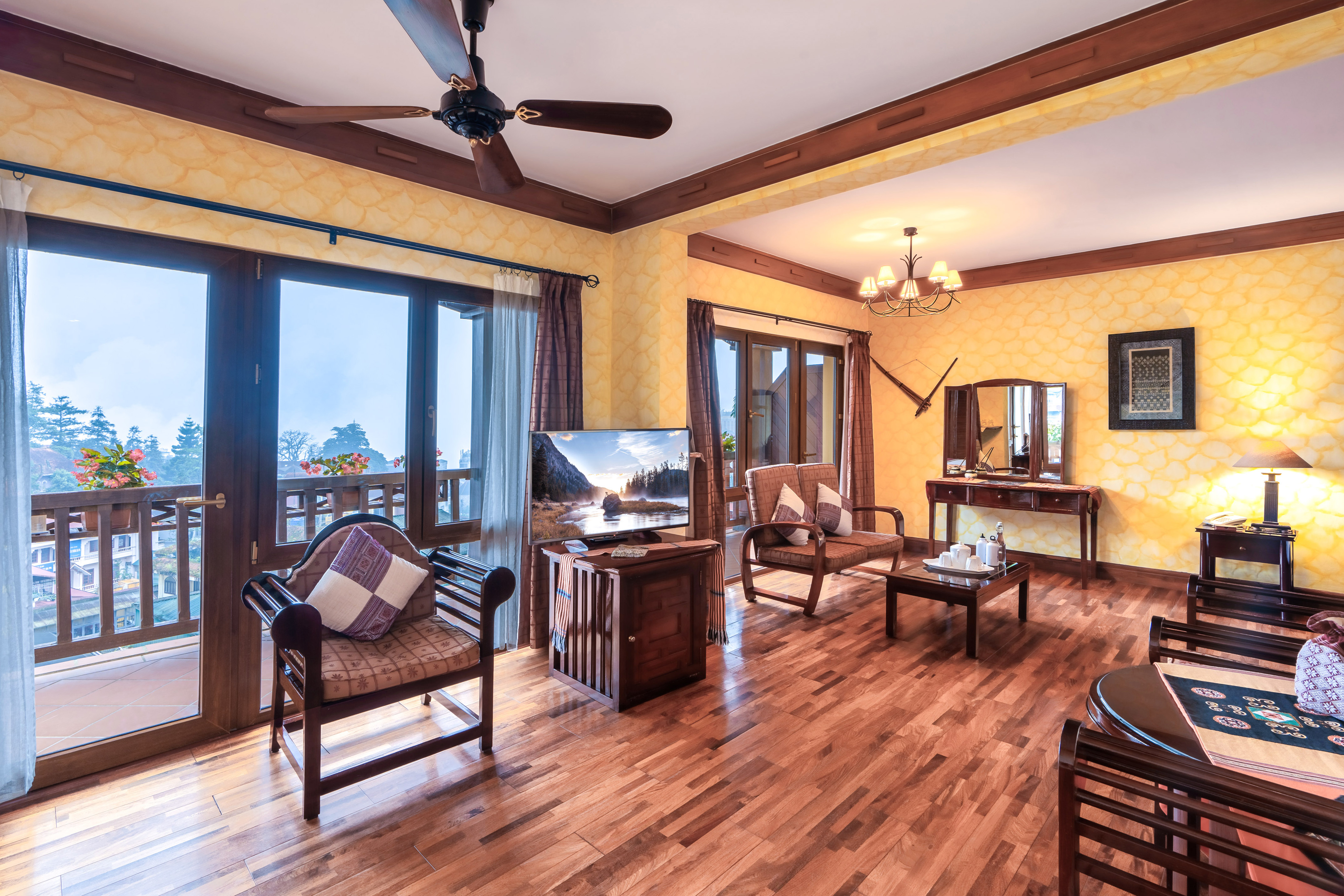 a room with a wood floor and a ceiling fan