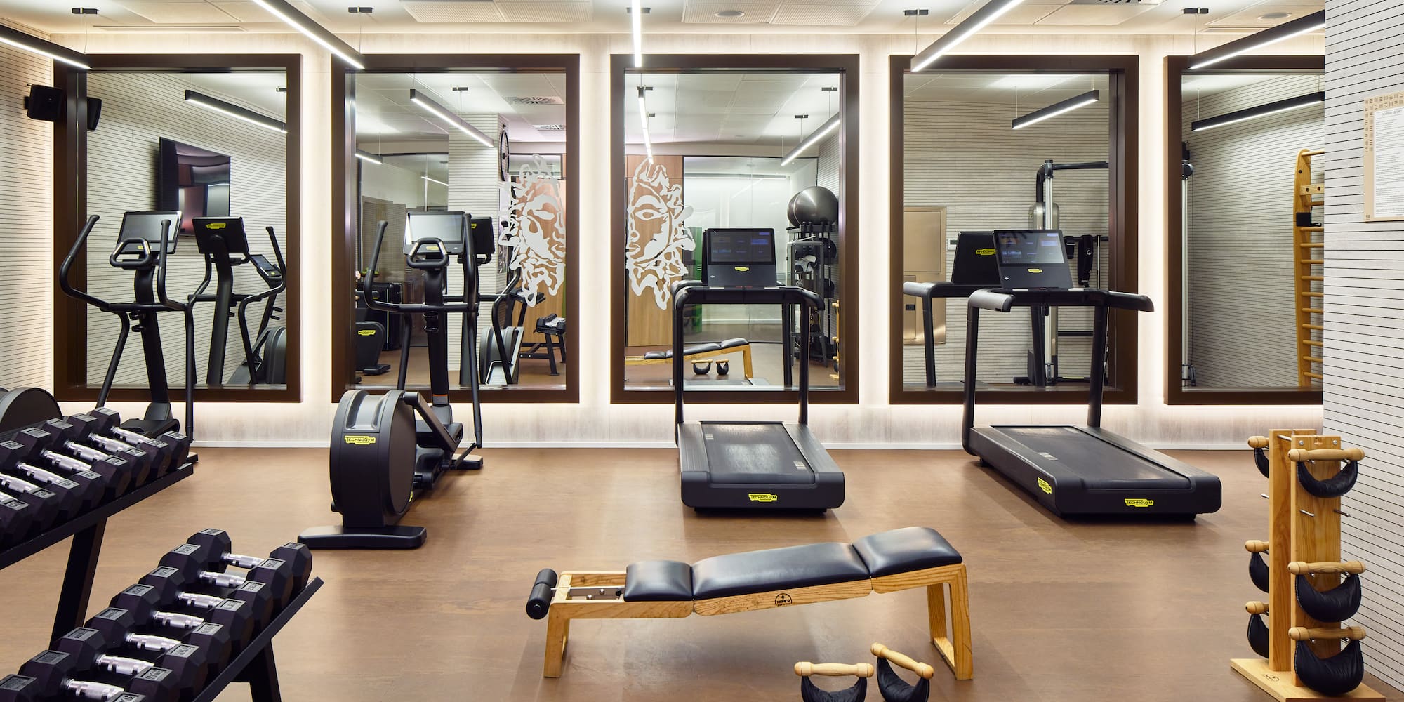 a room with treadmills and exercise equipment