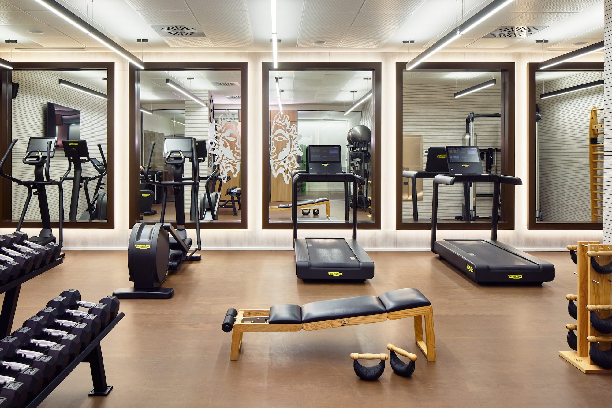 a room with treadmills and exercise equipment