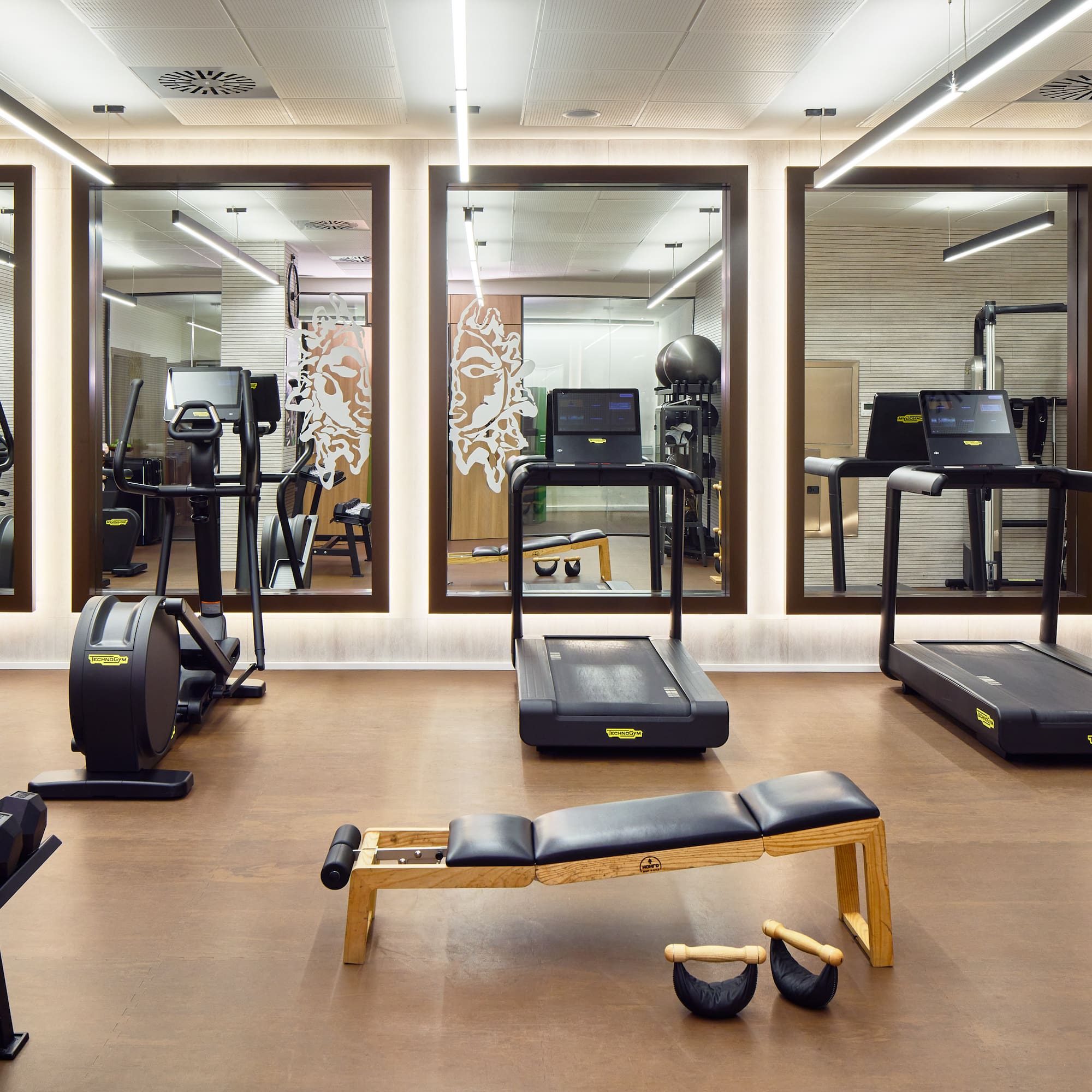 a room with treadmills and exercise equipment