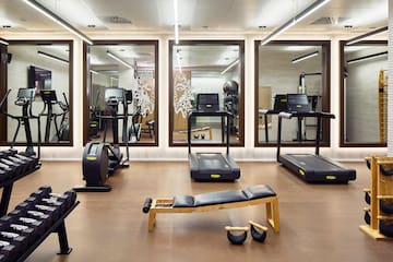 a room with treadmills and exercise equipment
